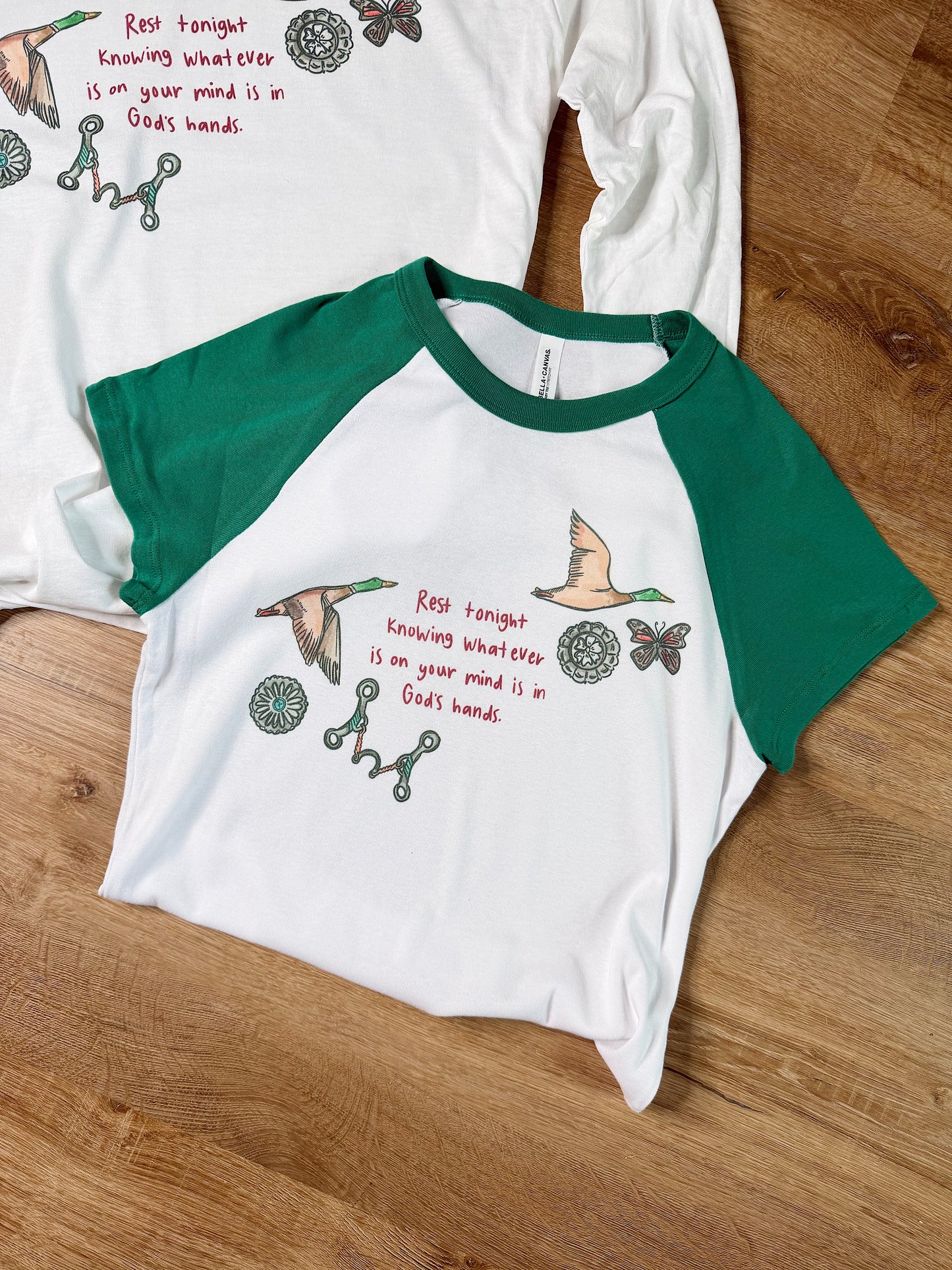 In God’s Hands Baby Tee